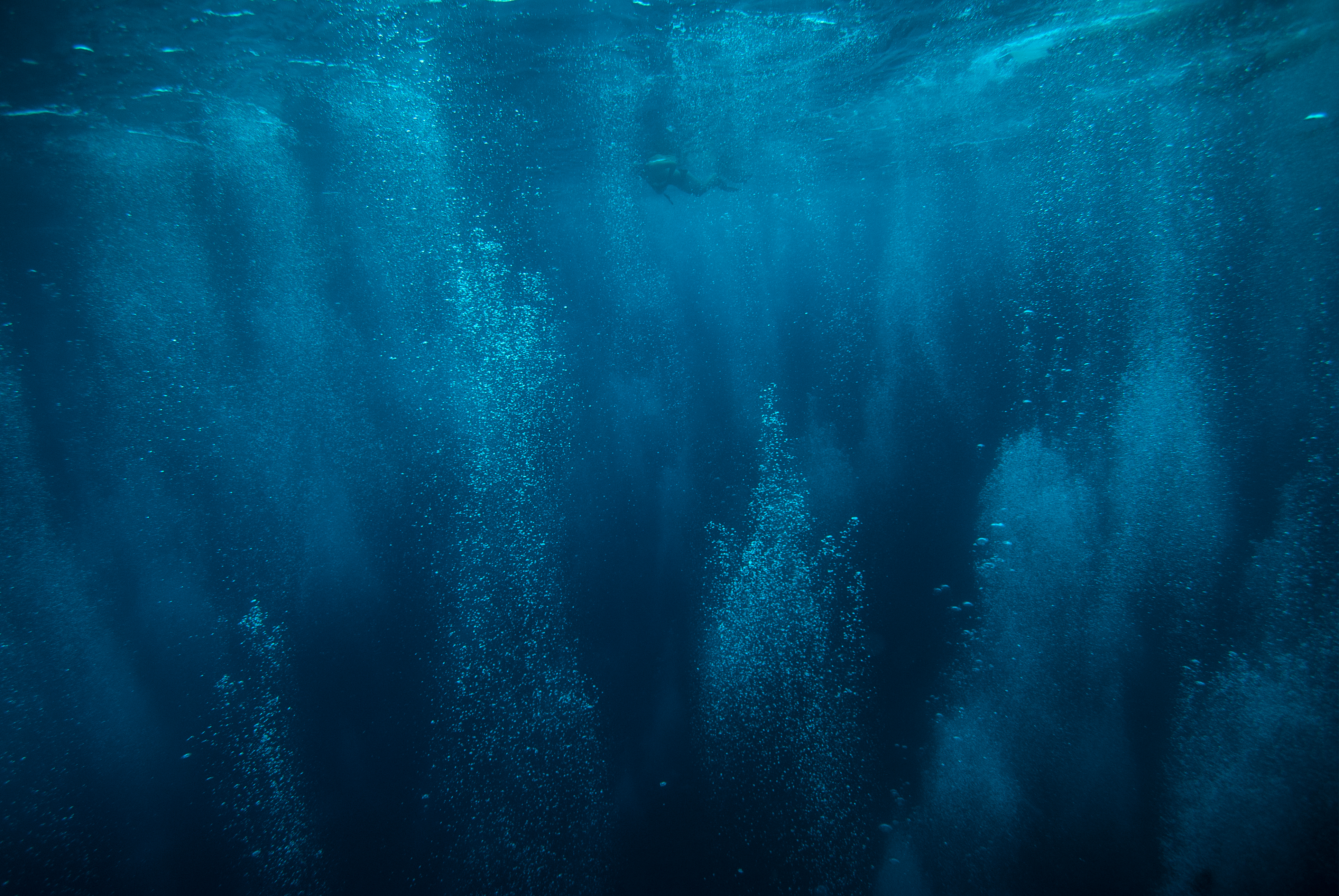 bubbles in dark blue water