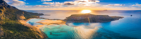 Aegean island and coastline at sunset