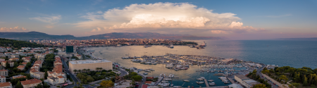 Panorama image of coastal settlement at sunset