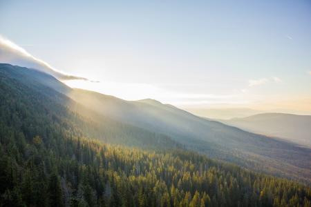 natural mountainous landscape - sun shining over mountain