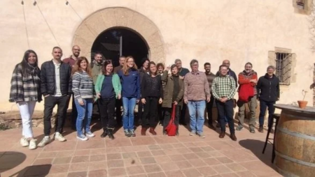 A group of wildE stakeholders standing by a wall.