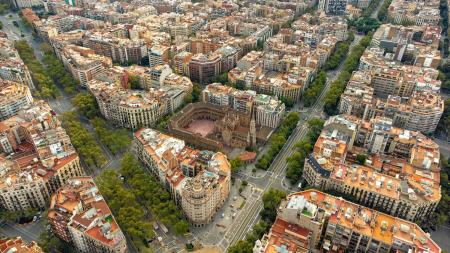 Barcelona's block development with tree lined streets.