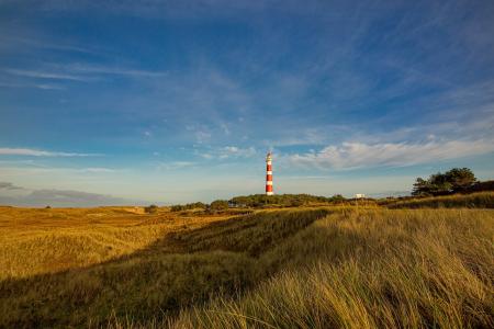 A lighthouse in sand dunes at Ameland, The Netherlands