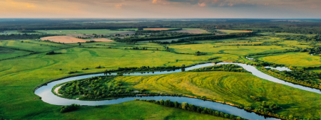 freshwater header - meandering river through green fields