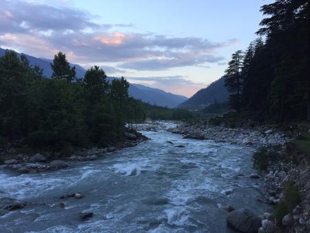 flowing river with stillness of the mountains 