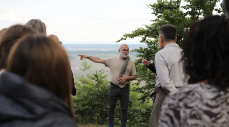 Workshop participants listen to Vladimír Buřt during an excursion to Jezeří Chateau, from where they had a view of the ČSA open-pit quarry. Picture: Jukka-Pekka Ronkainen / Syke 