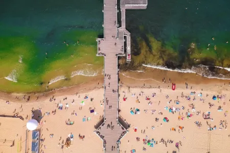 Aerial view of the beach and the sea with a platform in the middle