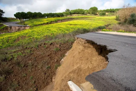 Broken road as a result of flooding