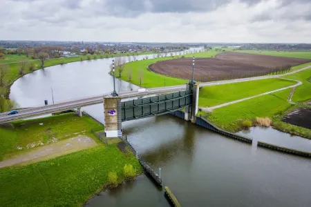 A gray barrier built above the river