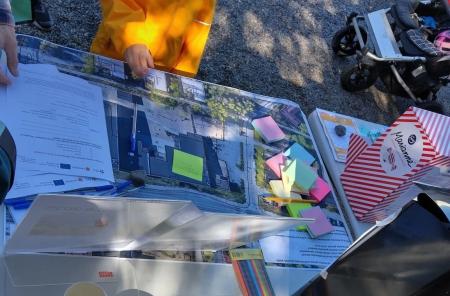 Papers and pens on a table outside