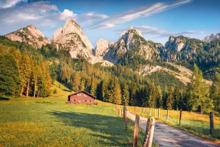 Wooden chalet on the shore of Gosausee lake in Austrian Alps.