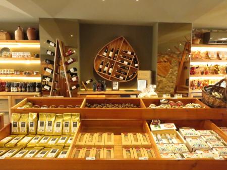 A display of packets, jars and bottles in a shop.