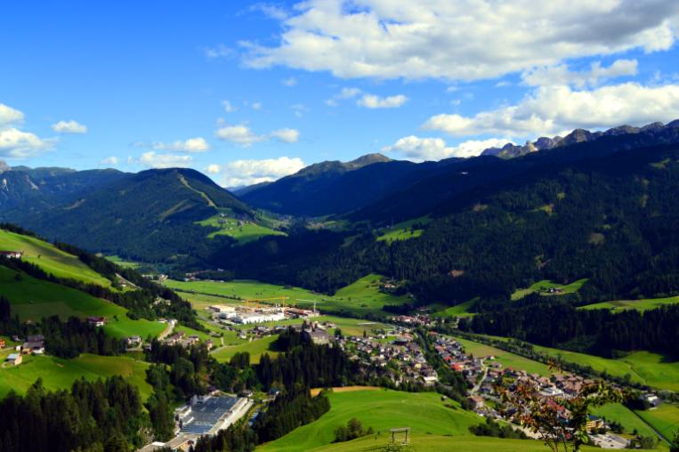 A view of a village in Tyrol with the mountains around.