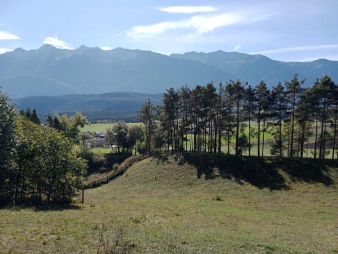 A landscape covered by rugged mountains and rolling valleys