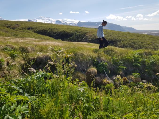 A person walking in a rural area.