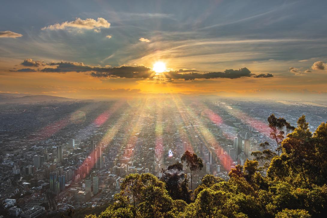 sunset with sun beams over the city 
